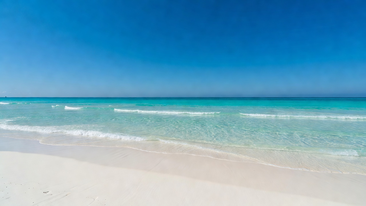 Sun rays reflecting through the crystal clear surface of tropical beach waters